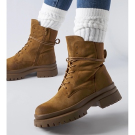 Brown boots with a worn toe from Vadnais 1