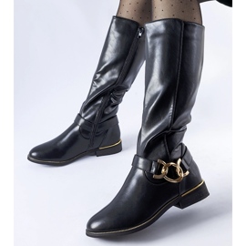 Black insulated boots decorated with an Ortega buckle 1