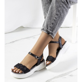 Black sandals on the Nandy platform 1