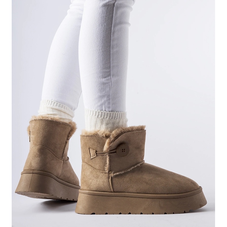 Brown insulated snow boots with a Ronco button 1