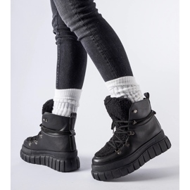 Black ankle boots on a massive Sforza platform 1