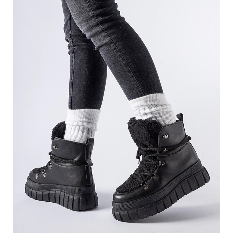 Black ankle boots on a massive Sforza platform 1