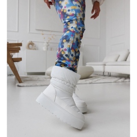 White insulated snow boots on the Polk platform 2