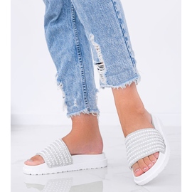 Trisha's richly decorated white slippers 1