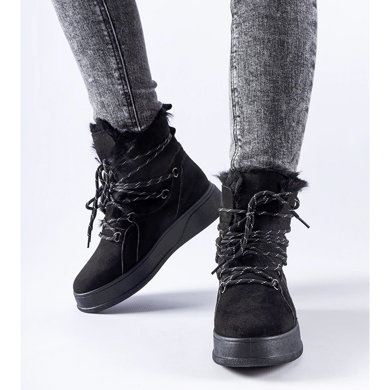 Black snow boots on the Rancourt platform 1