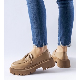 Beige moccasins decorated with a Cava buckle 1