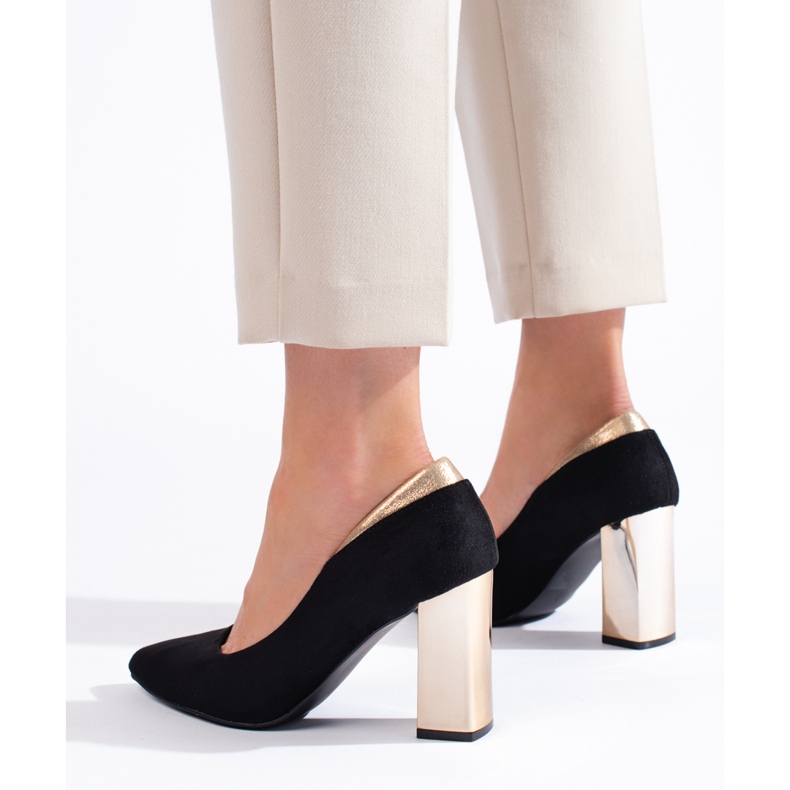 Black suede pumps on the pillar 1