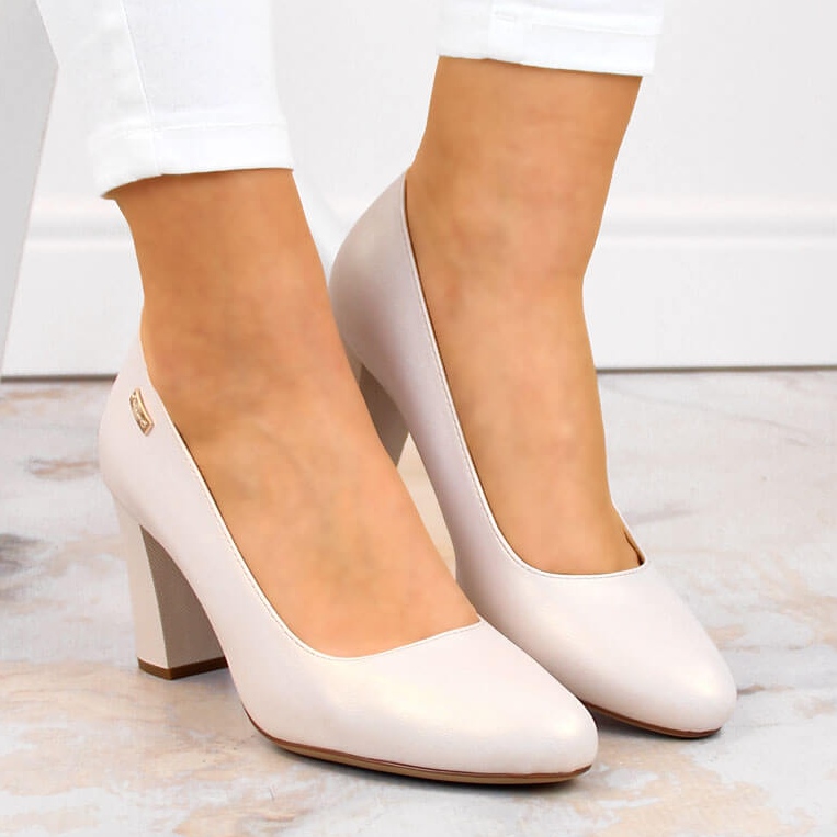 Beige pearl pumps on a decorative post from Sergio Leone 2