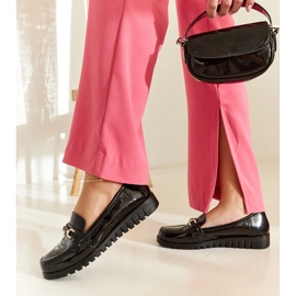 Black patent loafers with a Sardis buckle 1