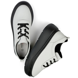 Women's white leather sneakers with a black sole 1