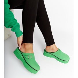 Green clog slides on the Lang platform 1