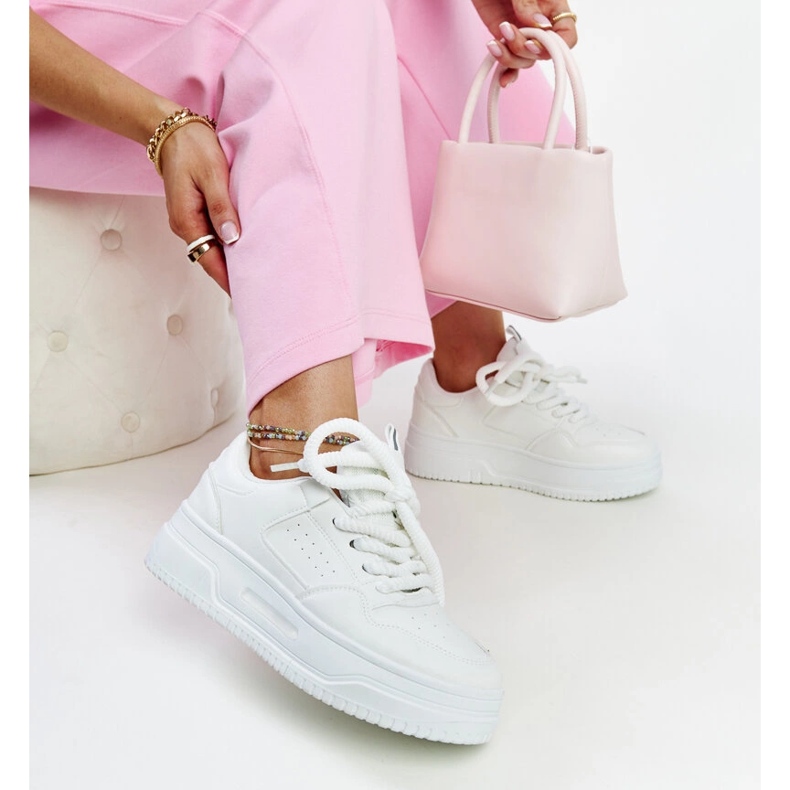 White sneakers with a high Lengyel platform 1