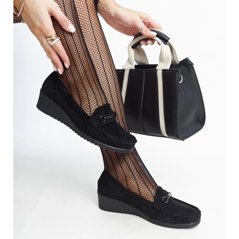 Amel's black wedge loafers 1