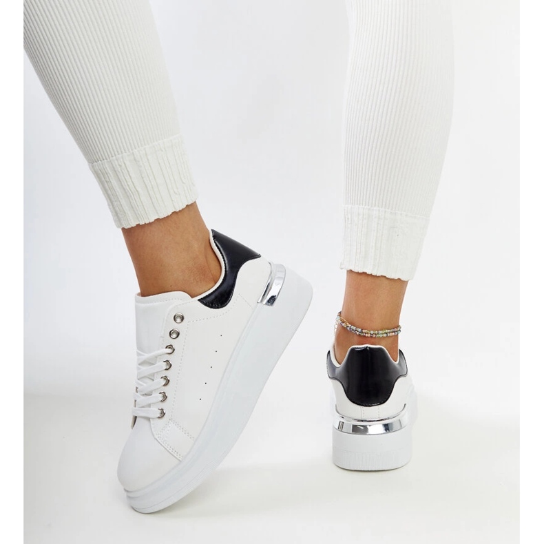 White sports shoes with a black Meriana insert 1 White sports shoes with a black Meriana insert 1