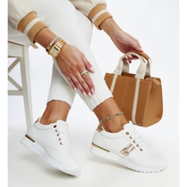 White and gold sneakers on the Nihad rubber platform 1