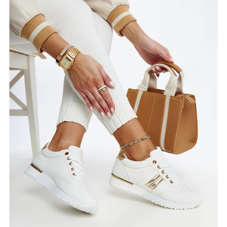 White and gold sneakers on the Nihad rubber platform 1