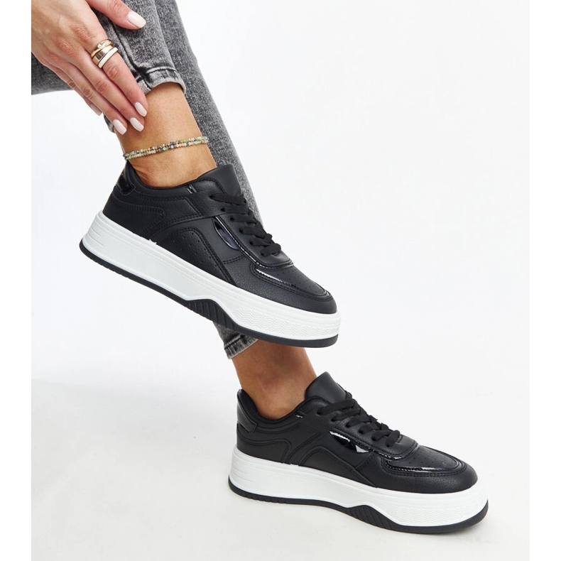 Black sneakers with a thicker Intis sole 1