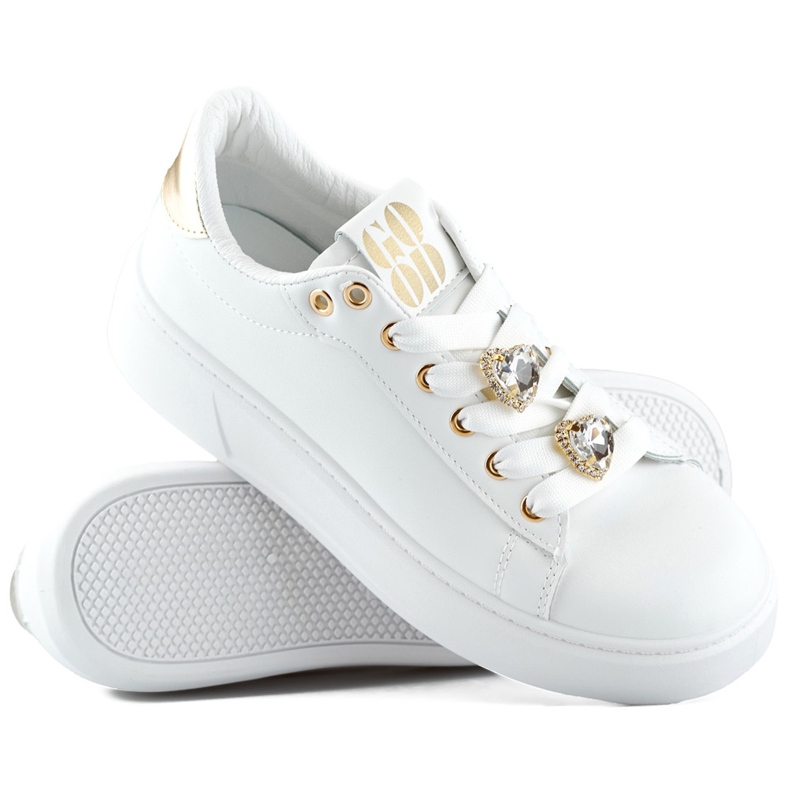 White fashionable women's sneakers with decorations on the laces, sneakers with a teddy bear 1