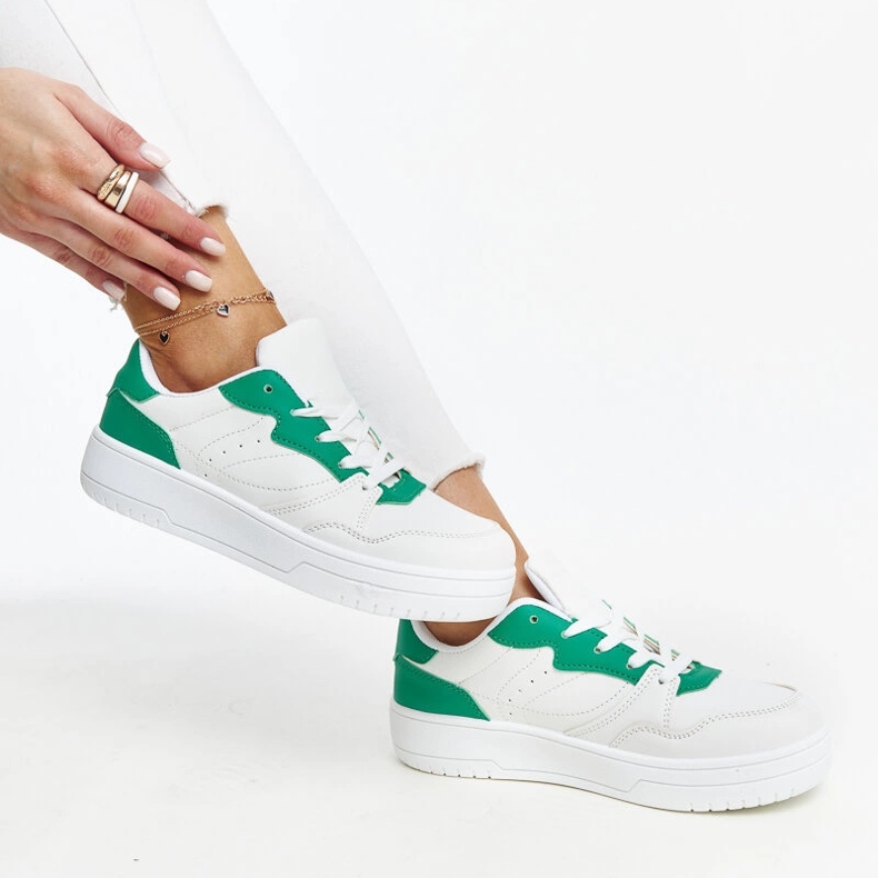 White sneakers with a green Fournie accent 1 White sneakers with a green Fournie accent 1