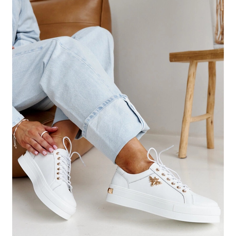White leather shoes with a decorative buckle 1
