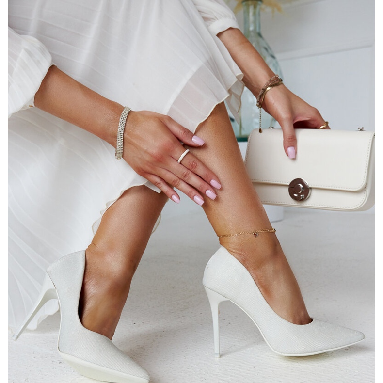 White shiny high heels with a leather insert by Cortesa 2