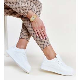 White sneakers with a thicker Intis sole 1