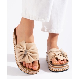 Beige suede slides with a bow 2