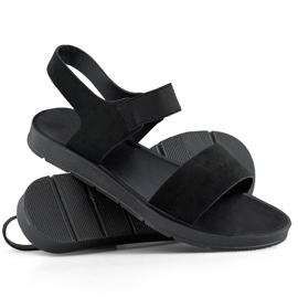 Black suede sandals with elastic band and a flat sole 1