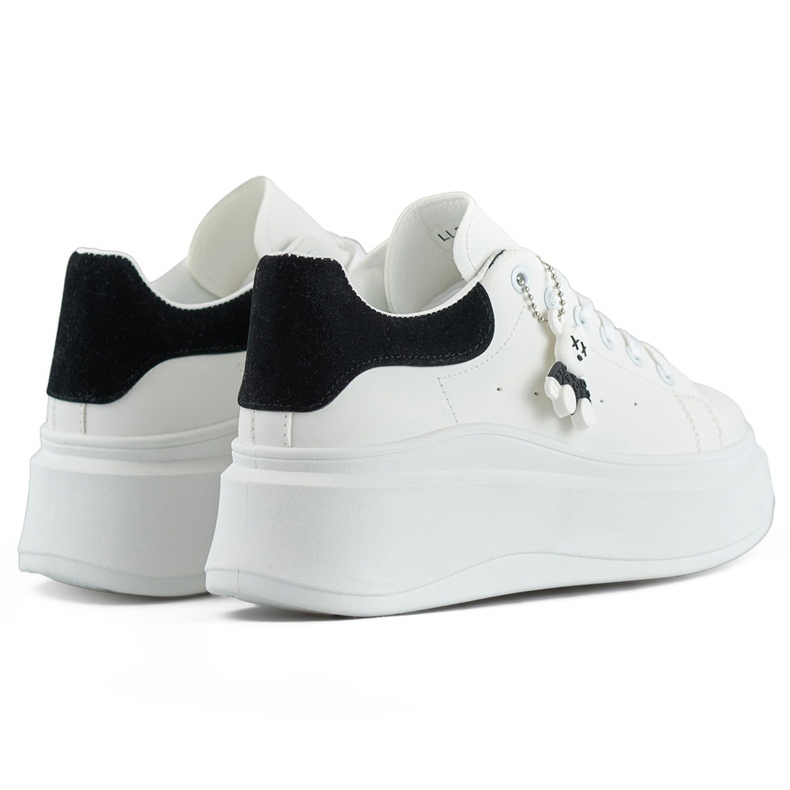 White sports shoes with a thick sole and a black teddy bear 1 White sports shoes with a thick sole and a black teddy bear 1