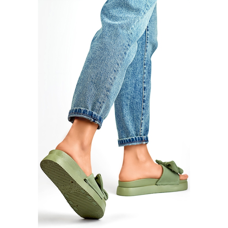 Light green women's slippers with a bow on a thick sole 1