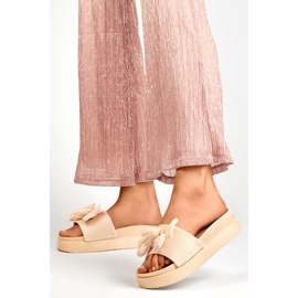 Beige women's slippers with a bow on a thick sole 2