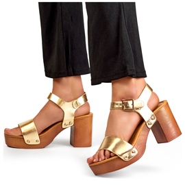 Gold sandals with a wooden platform heel golden 1