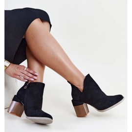 Black asymmetrical insulated ankle boots by Nadica 1