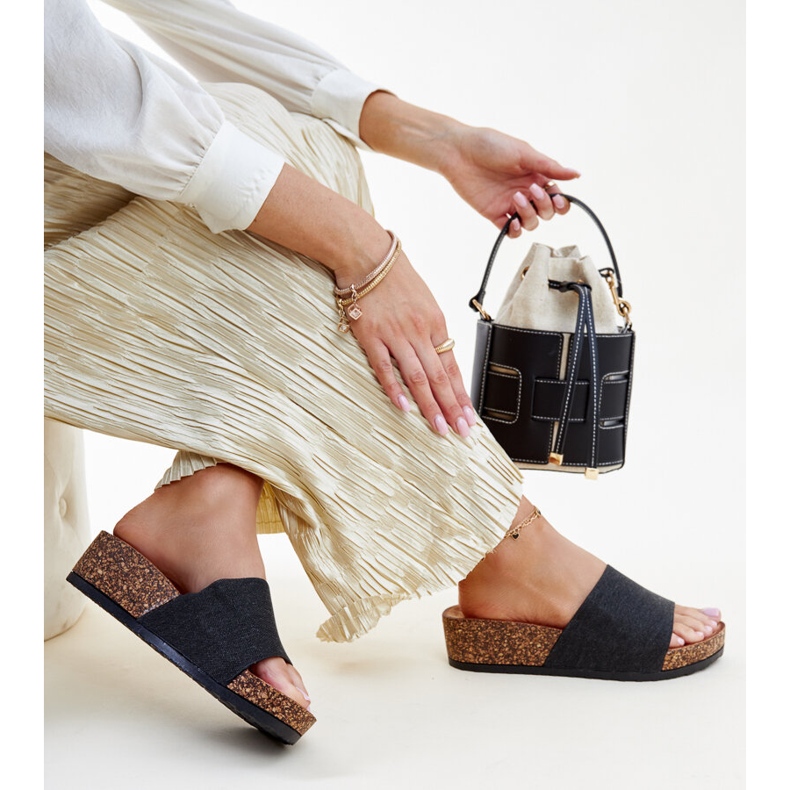 Black flip-flops with a Naifene cork wedge 1