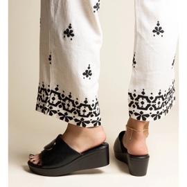 Black wedge mules with a Keirenh buckle 2