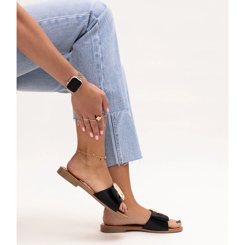 Black flip-flops with a Limera buckle 1