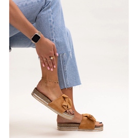 Brown flip-flops with a massive Peletra sole 1