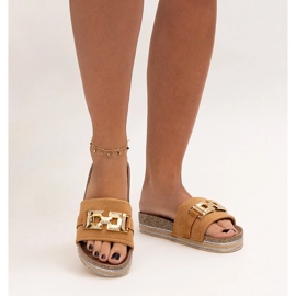 Brown flip-flops with a shiny buckle by Niamh 2