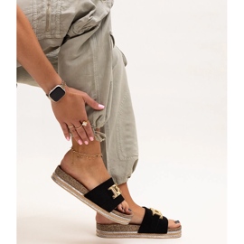 Black flip-flops with a shiny buckle by Niamh 1