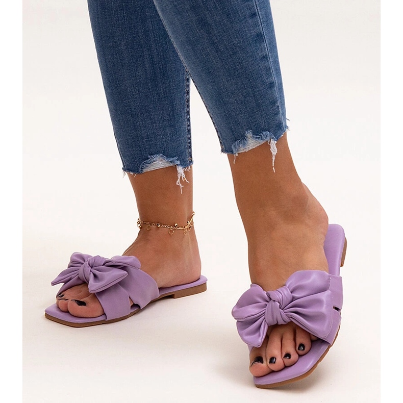 Purple flip-flops with a decorative bow by Uwansa 1