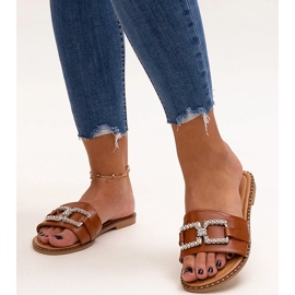 Brown flip-flops with a decorative buckle by Rochaela 1