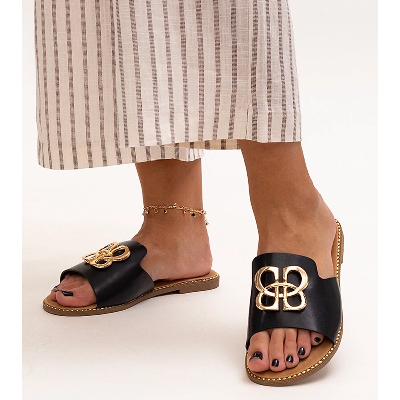 Black flip-flops decorated with a Perkin buckle 1 Black flip-flops decorated with a Perkin buckle 1