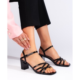 Black elegant low-heeled sandals by Sergio Leone 1