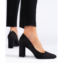 Black suede pumps with a thick heel by Sergio Leone 1