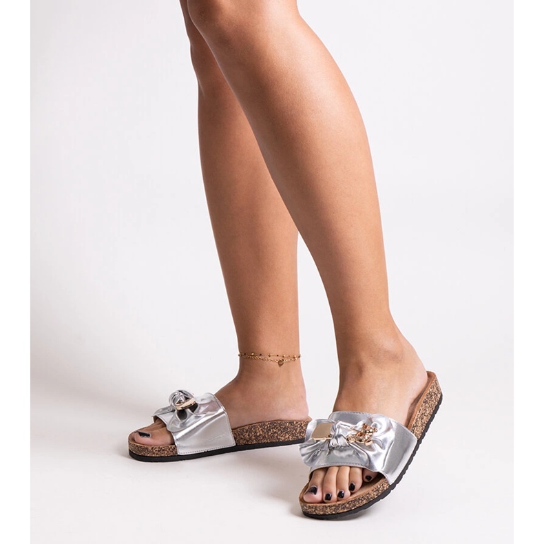 Silver flip-flops with a bow and a Segan teddy bear 1