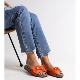 Orange flip-flops with a bow and a Segan teddy bear 2