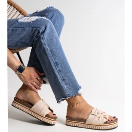 Massive beige flip-flops with a decorative Nibalie sole 1