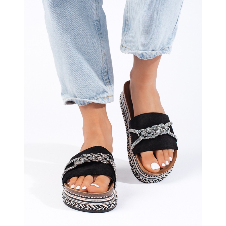 Black slippers on the platform 1