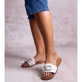 White flip-flops with a decorative buckle by Rochaela 1