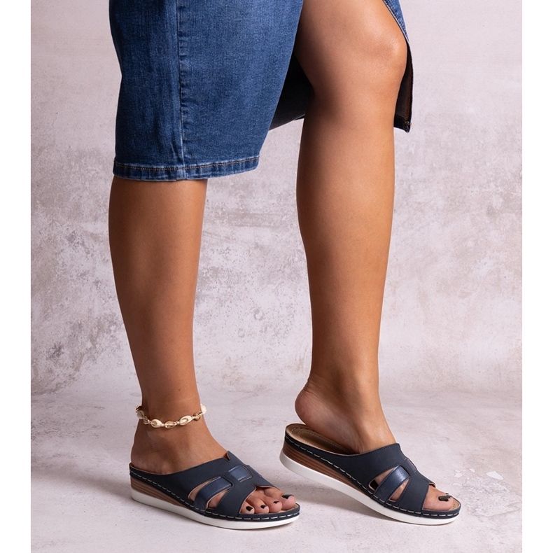 Navy blue lightweight flip-flops with a low wedge from Mifsuda 1